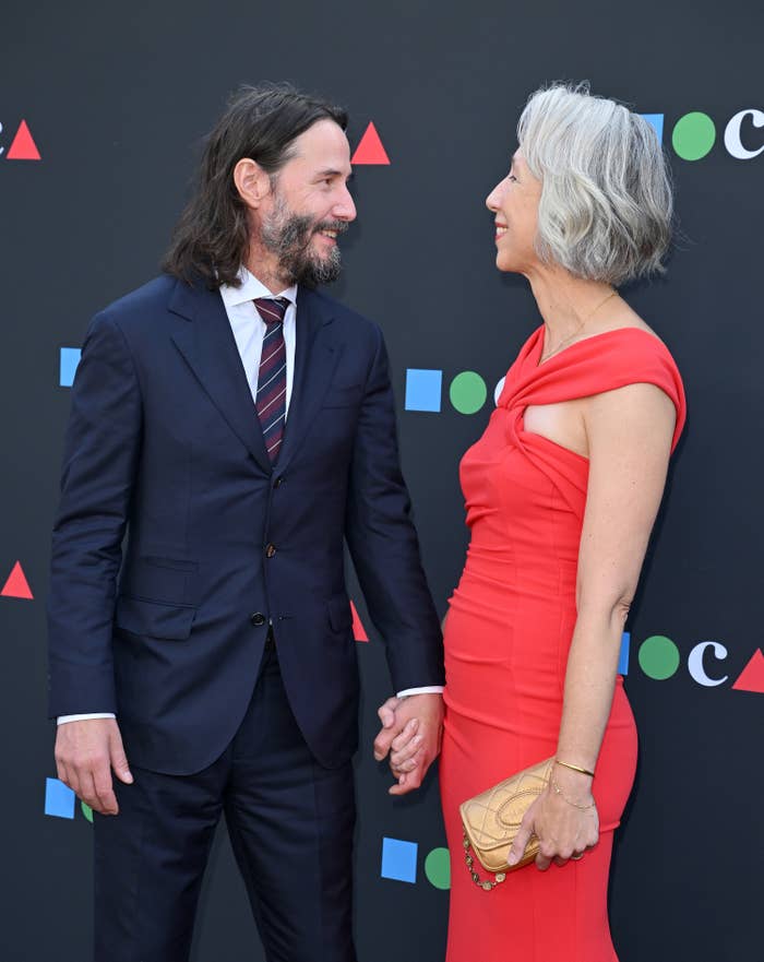 Keanu looks over at Alexandra and smiles