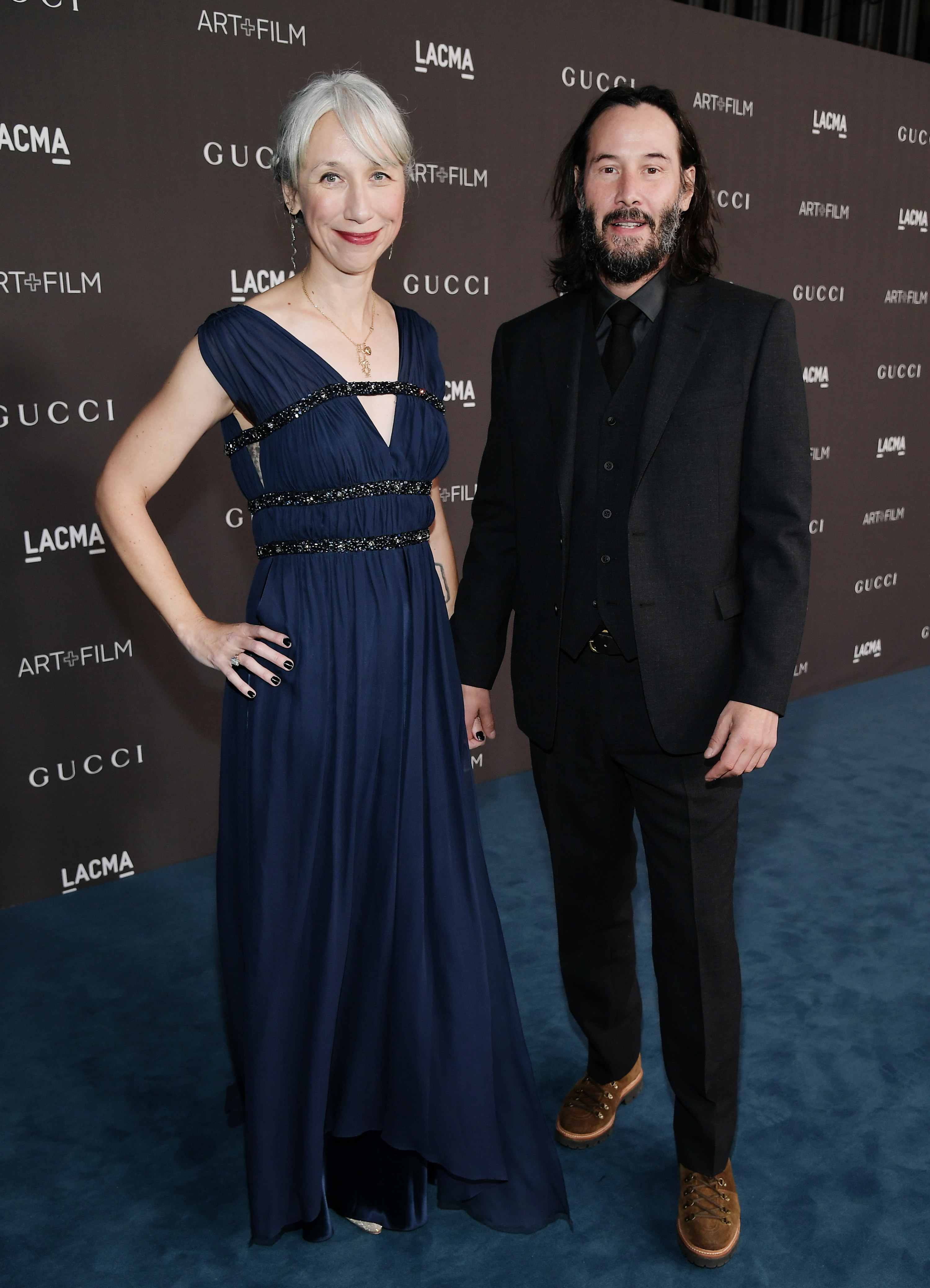 Keanu and Alexandra hold hands during their first red carpet