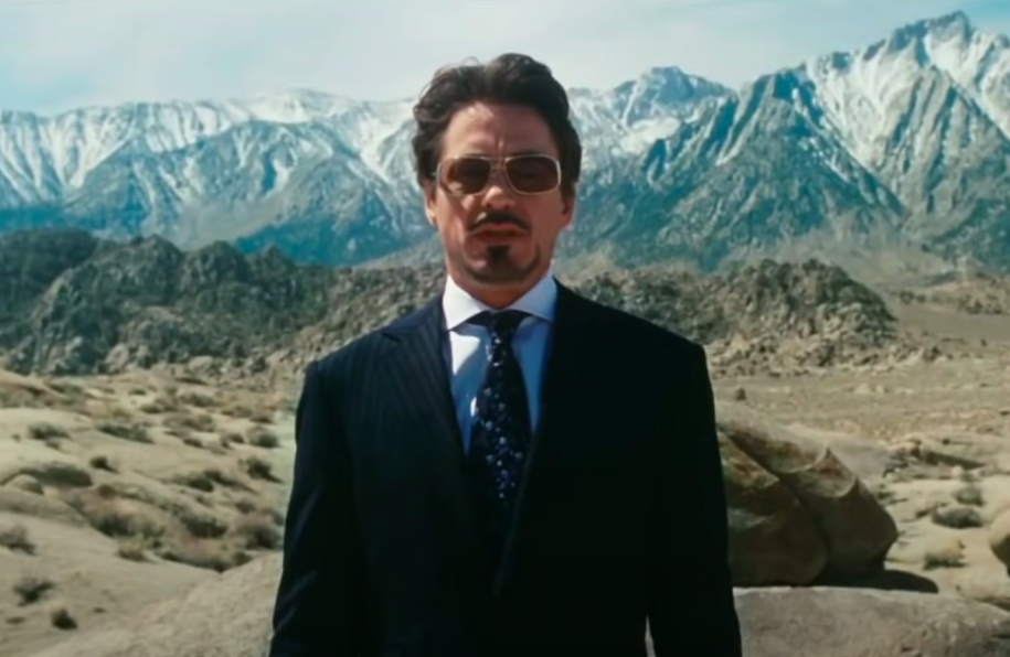 Robert Downey Jr. in character in front of mountains
