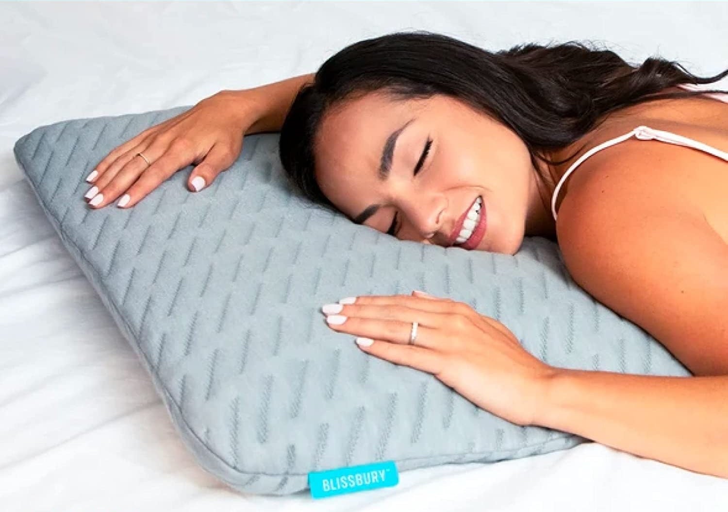a person sleeping on their stomach with the pillow under their head