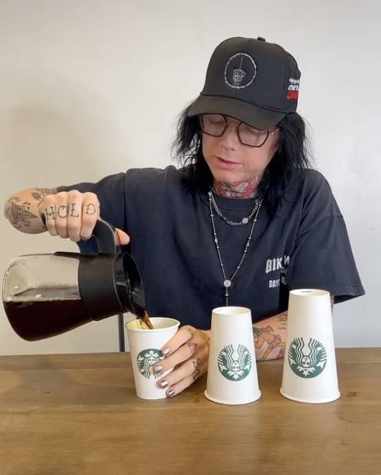 Sueco pouring coffee into different-sized Starbucks cups; the two largest sizes are flipped upside down and you can&#x27;t see inside them