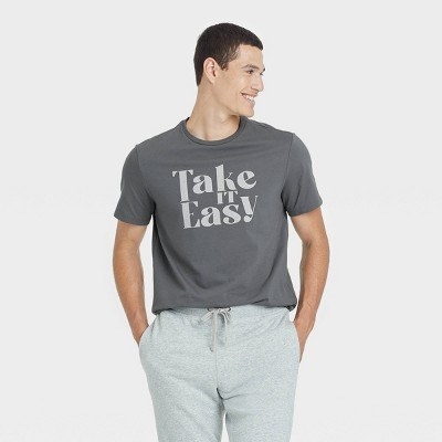 The model wears the grey shirt that says &quot;Take IT Easy&quot; in white font