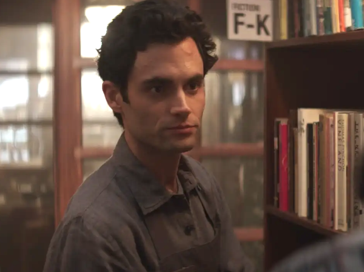 Penn Badgley in &quot;You&quot; in a library