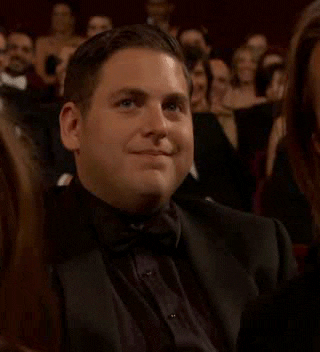Jonah Hill gestures for someone to stop what they&#x27;re doing at the Oscars in 2012