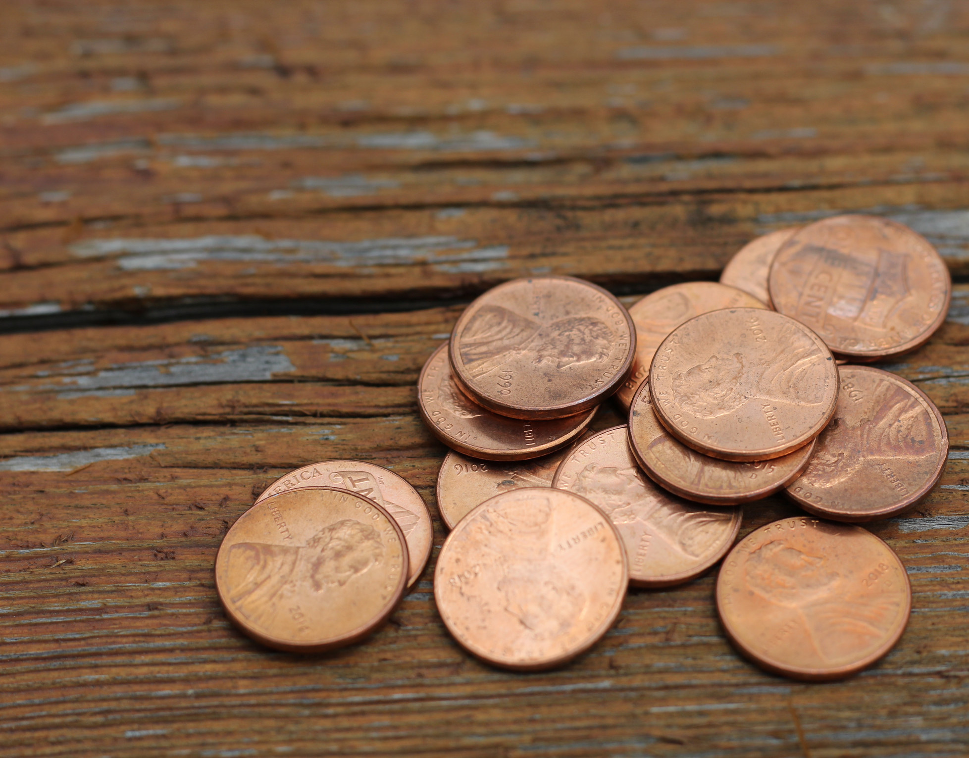 Pennies on a wooden surface