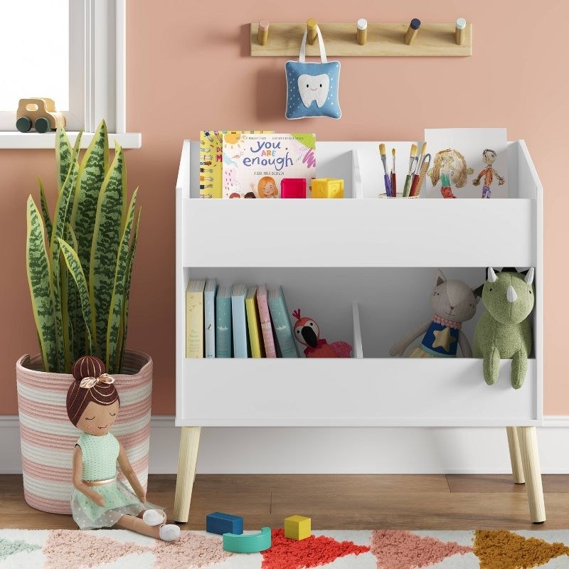 the multi-bin shelf with toys in it