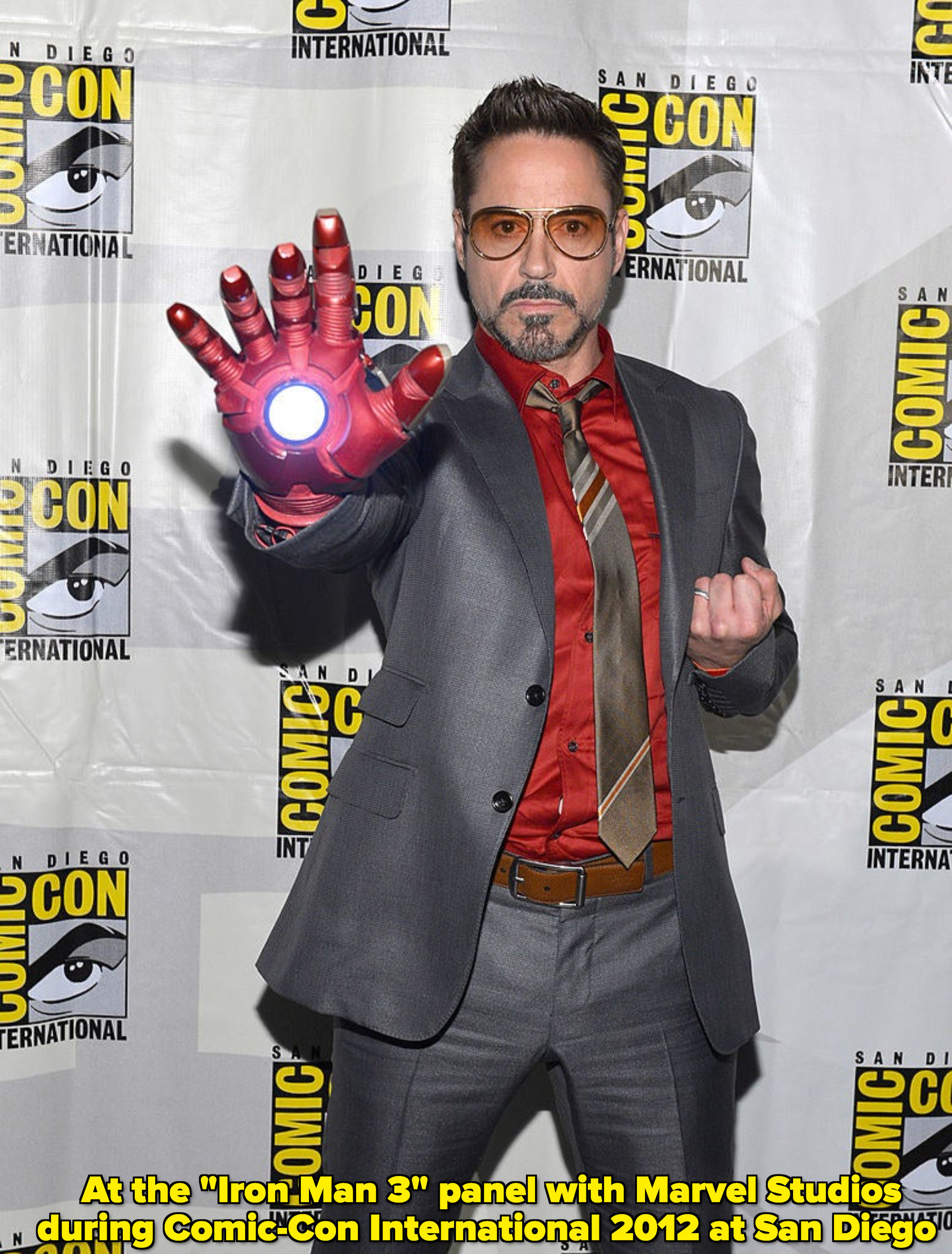 Robert Downey Jr at San Diego Comic Con with an Iron Man hand