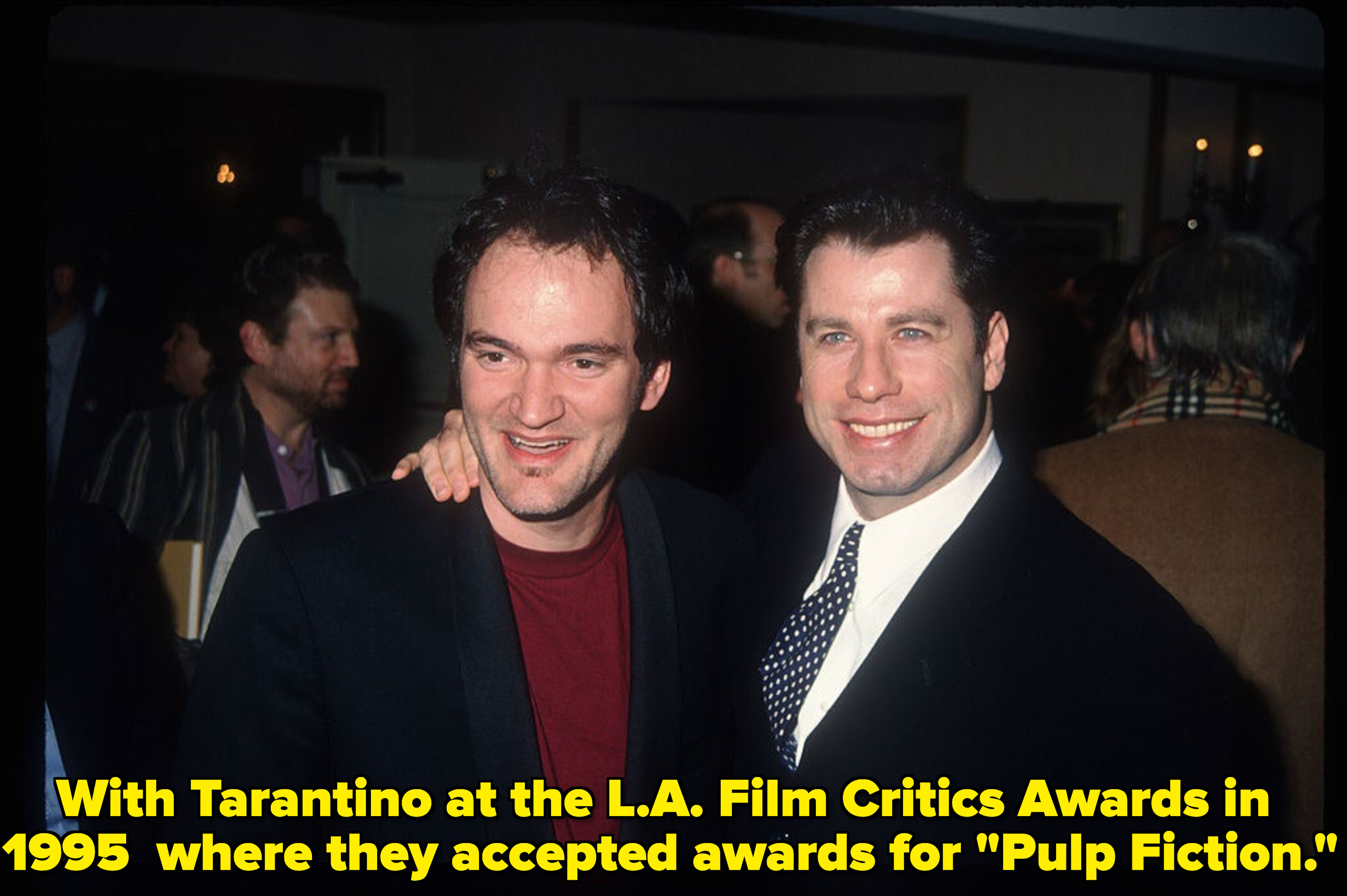 Quentin Tarantino and Travolta smile together at an event
