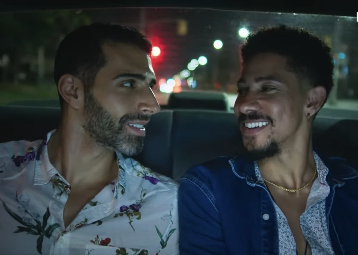 Keiynan Lonsdale and Samer Salem smile at each other in the back of a taxi