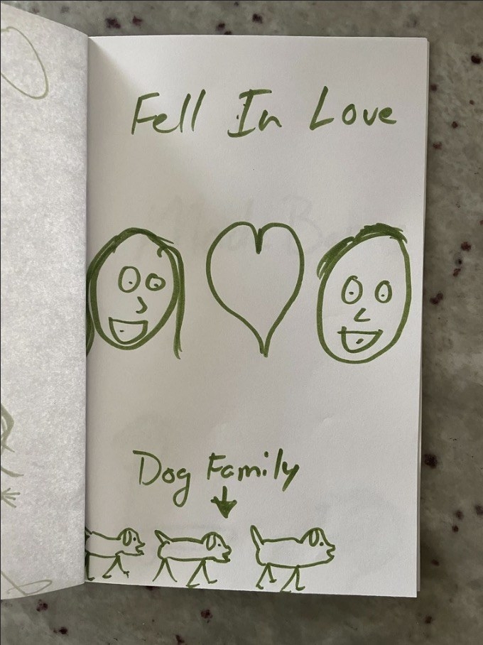 stick figure dog family and two floating heads with words, fell in love, over a heart