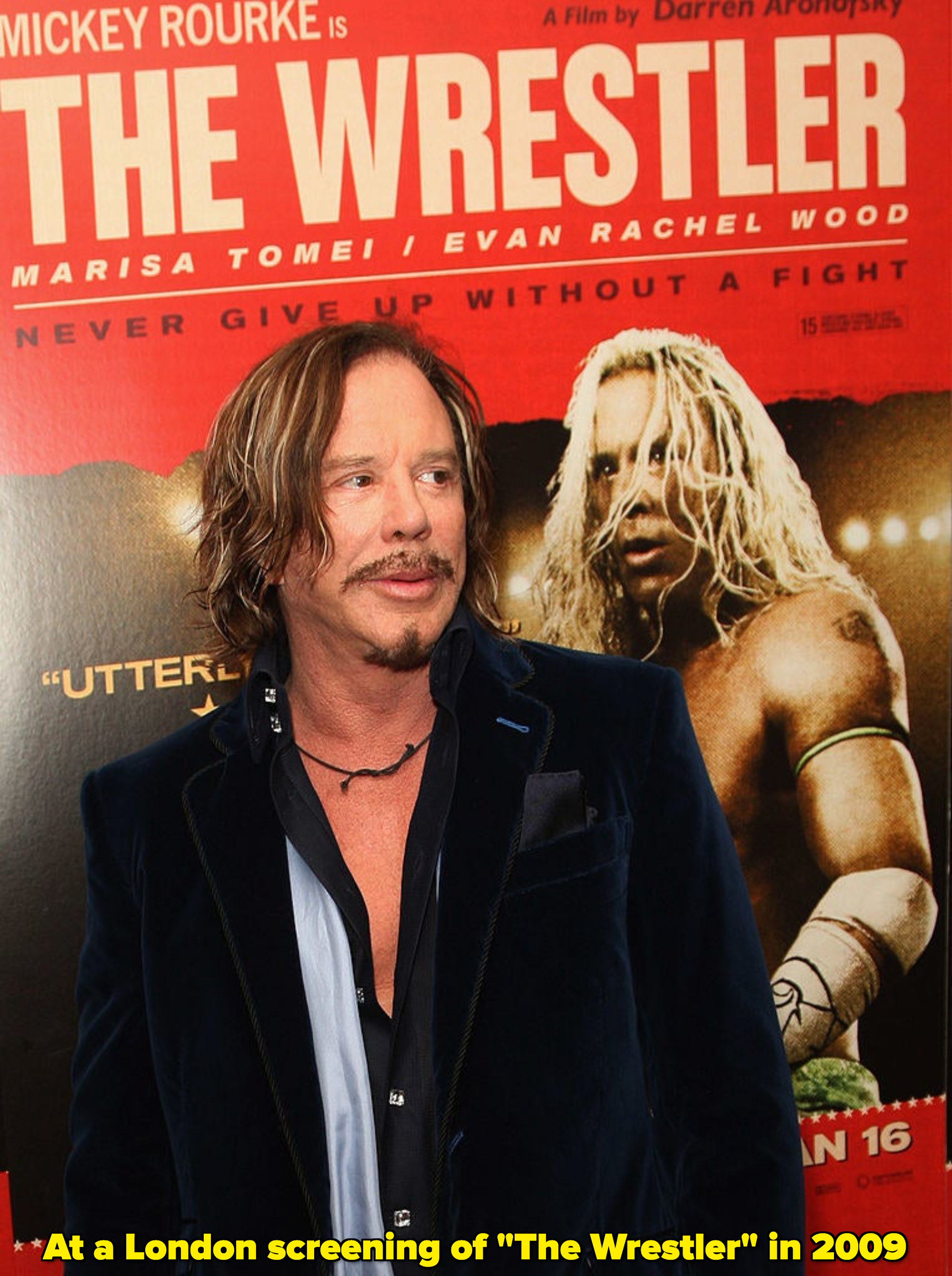 Mickey Rourke standing by a poster for &quot;The Wrestler&quot;