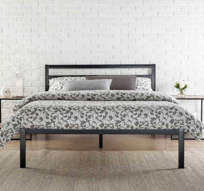 Black bed frame with floral duvet covers