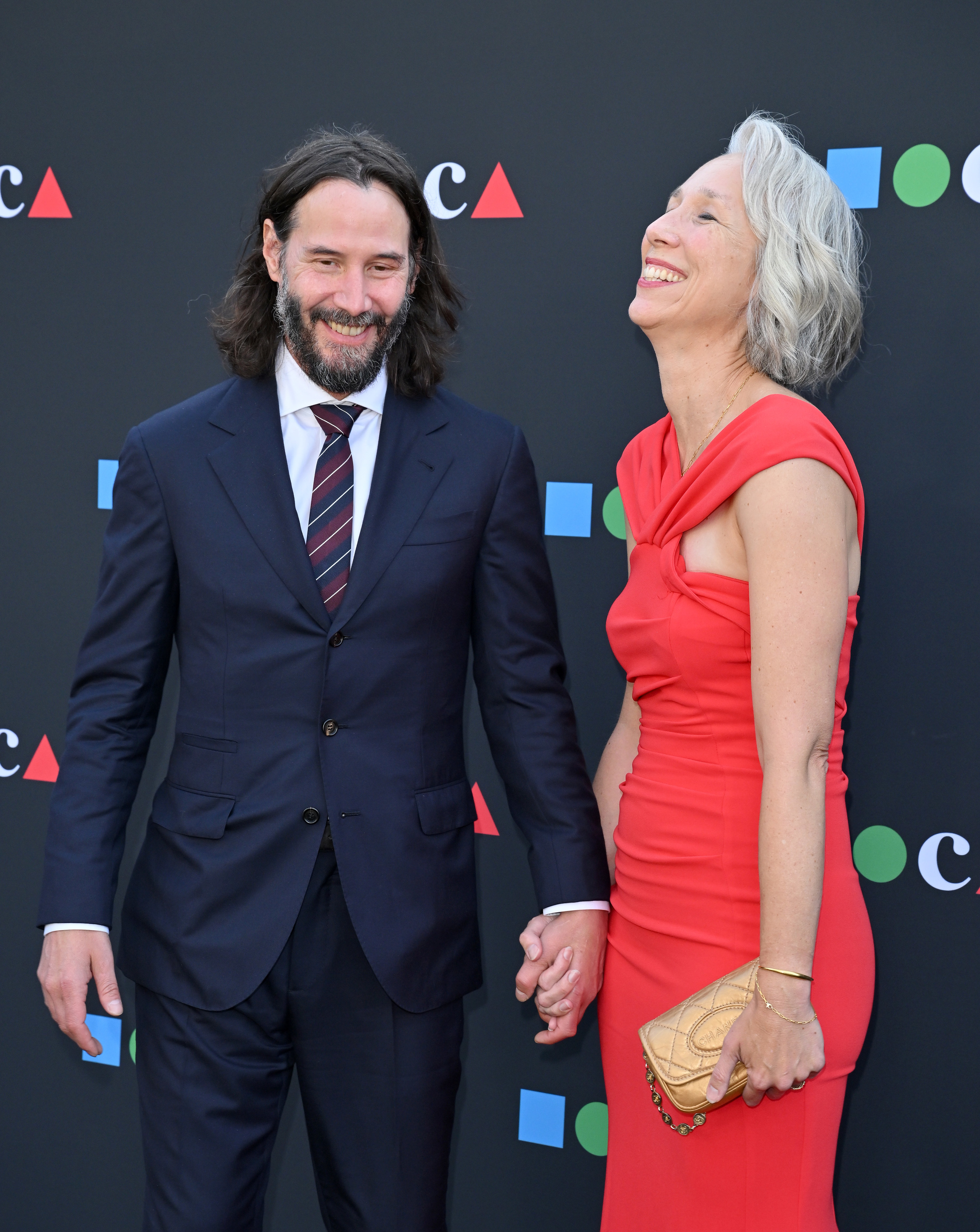Keanu and Alexandra laughing on the red carpet