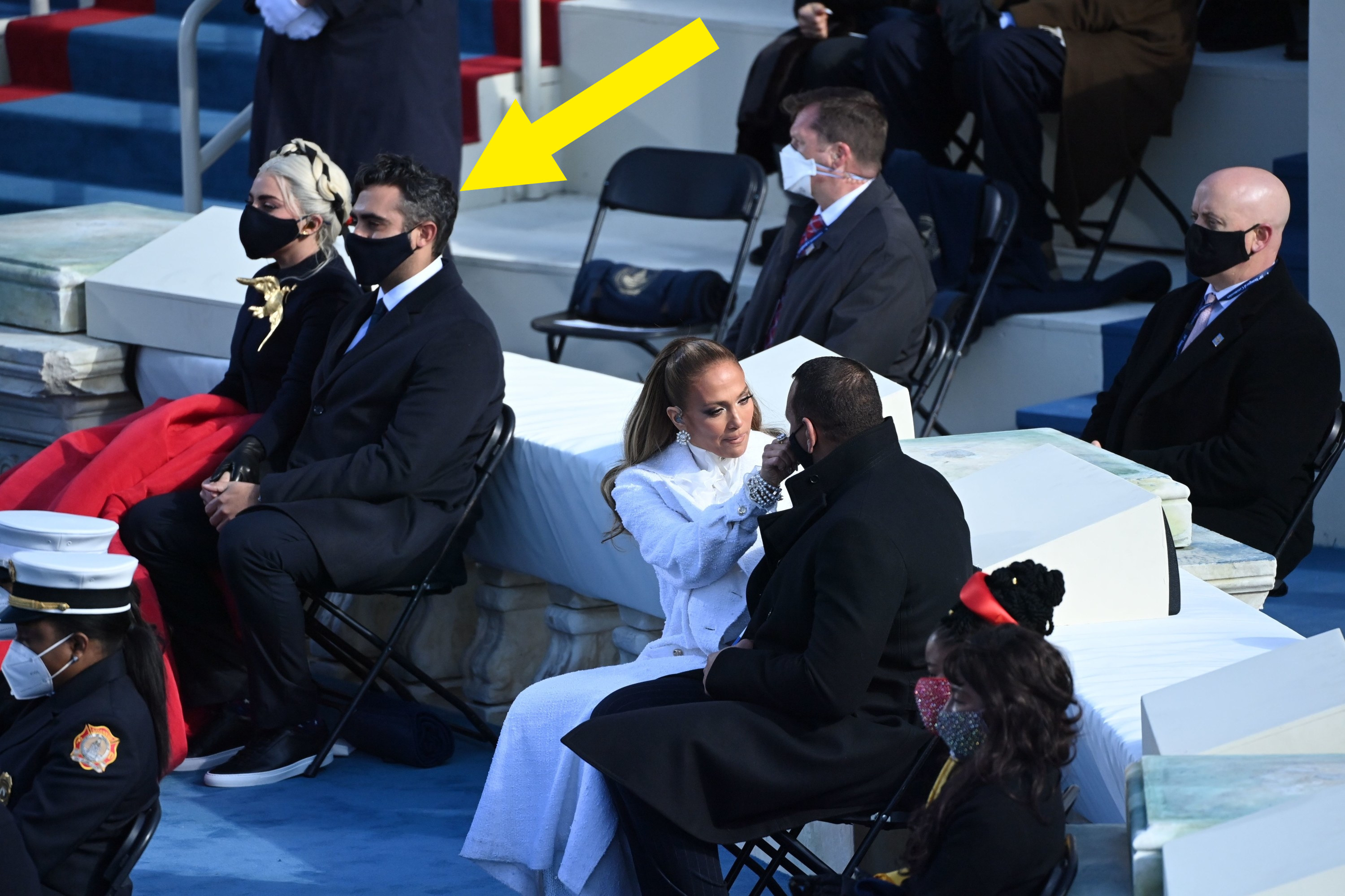 an arrow pointing to Michael as he sits with Lady Gaga