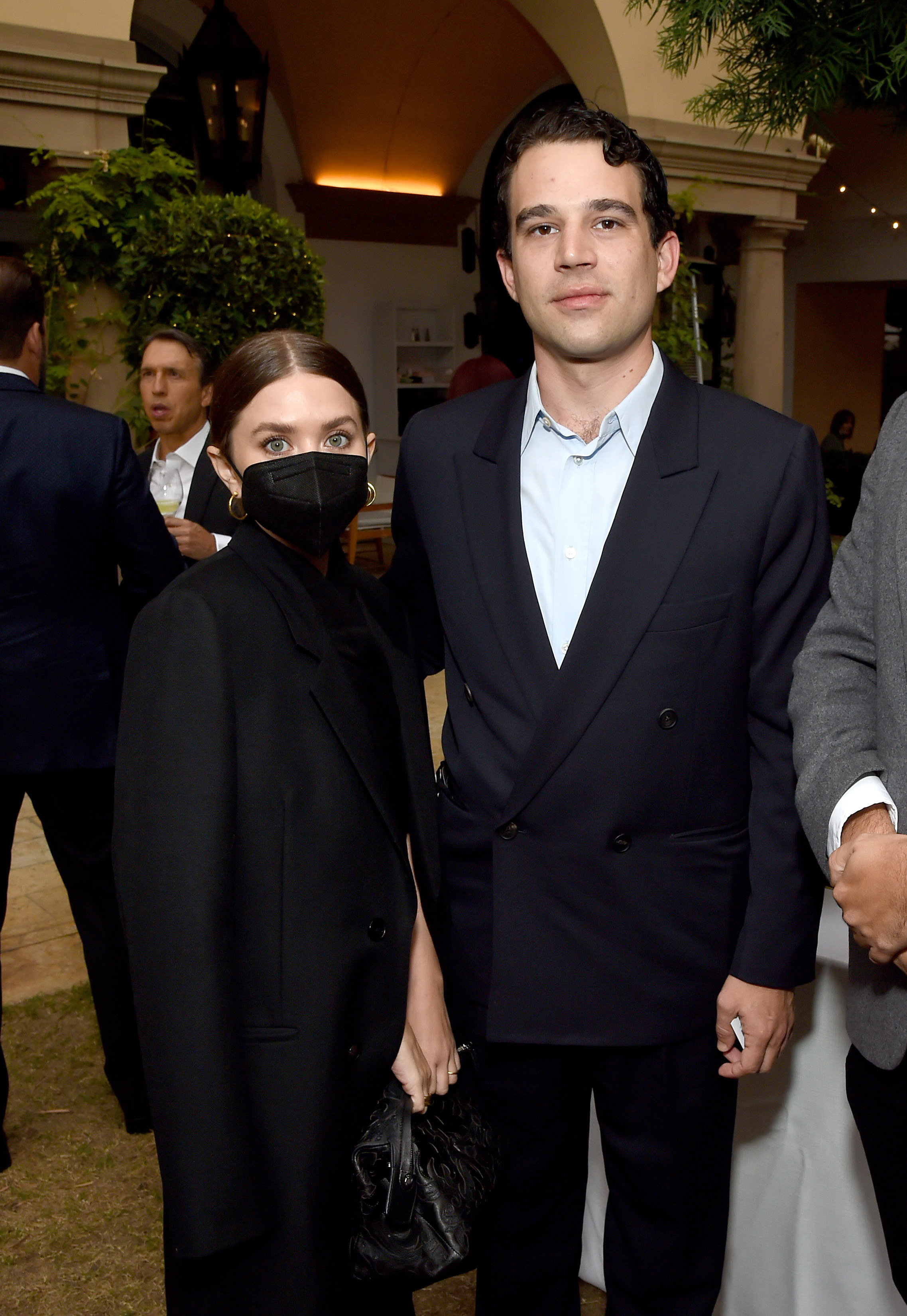 the two at an event with Ashley wearing a mask