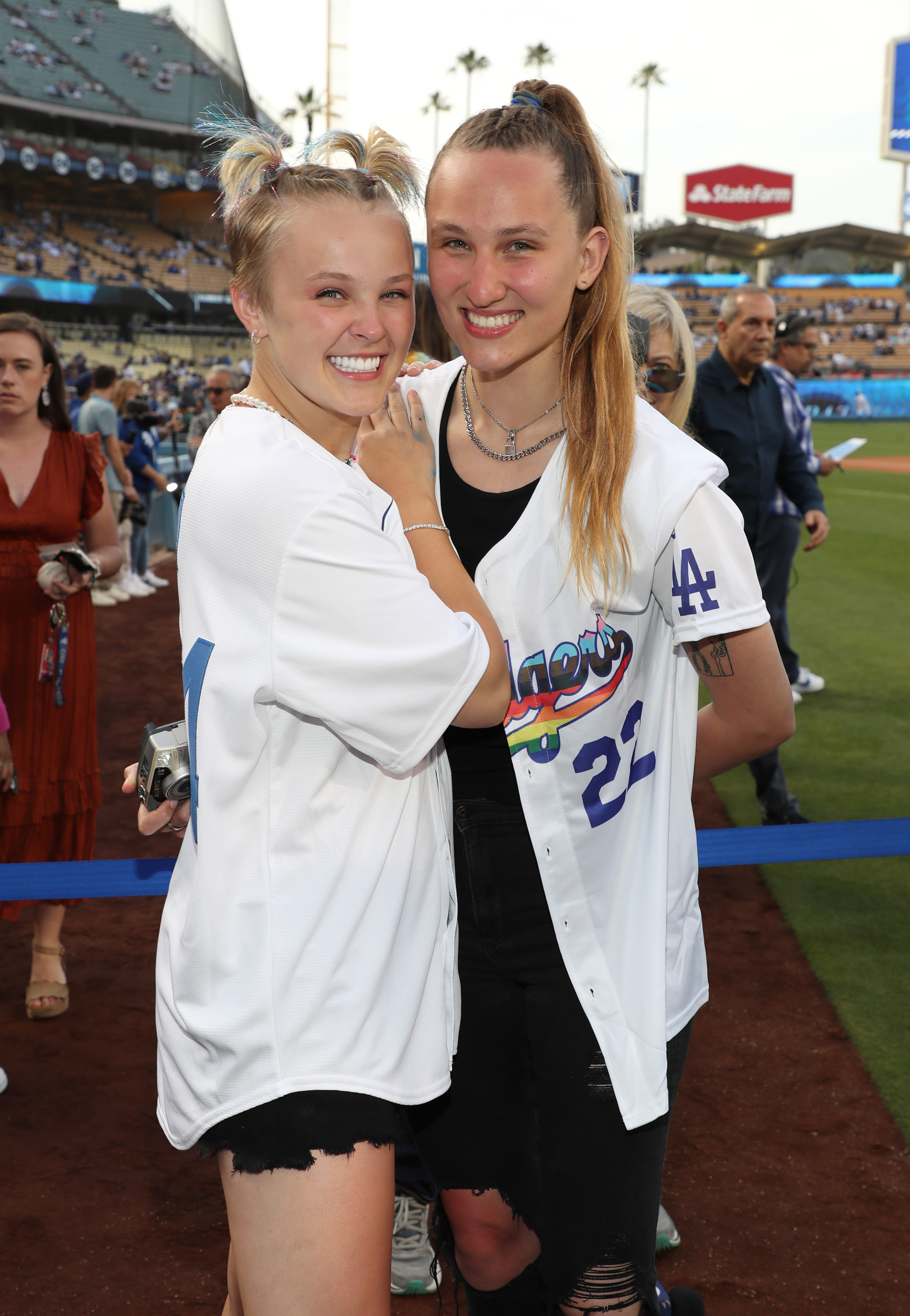the two posing at a dodgers game