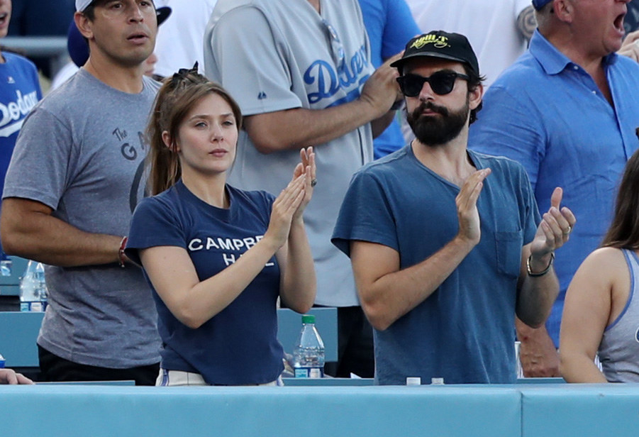 the two clapping at a baseball game