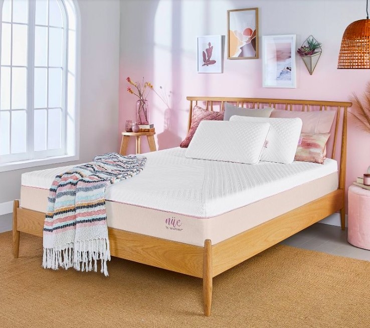 Mattress in a room with pink accents