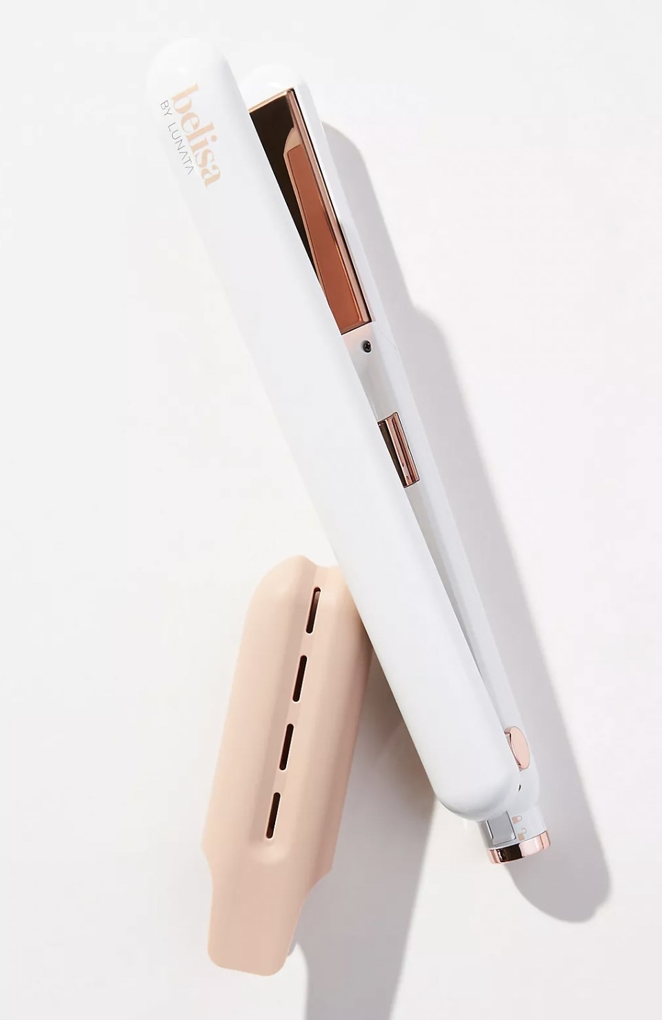 the flat iron in white next to its dusty pink case