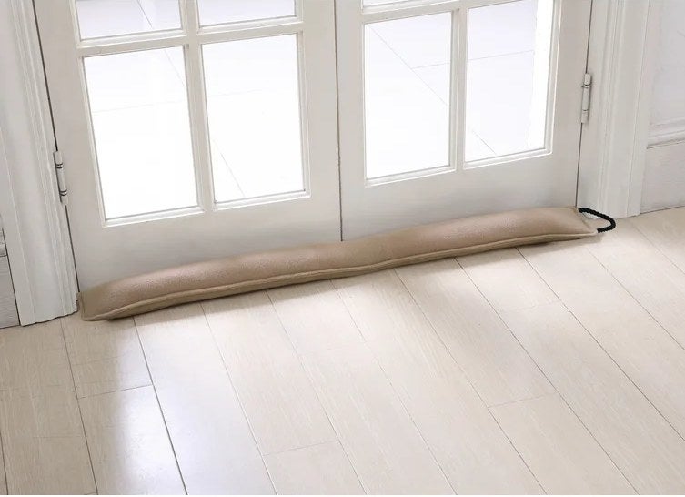 An image of a beige fleece fabric draft excluder