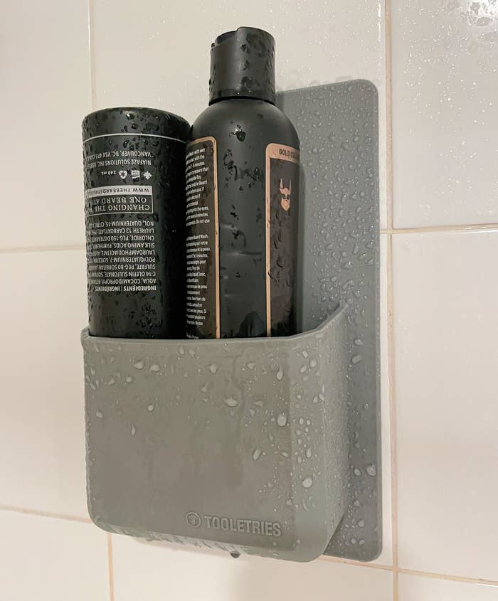 the silicone shower organizer mounted on a wet tile wall