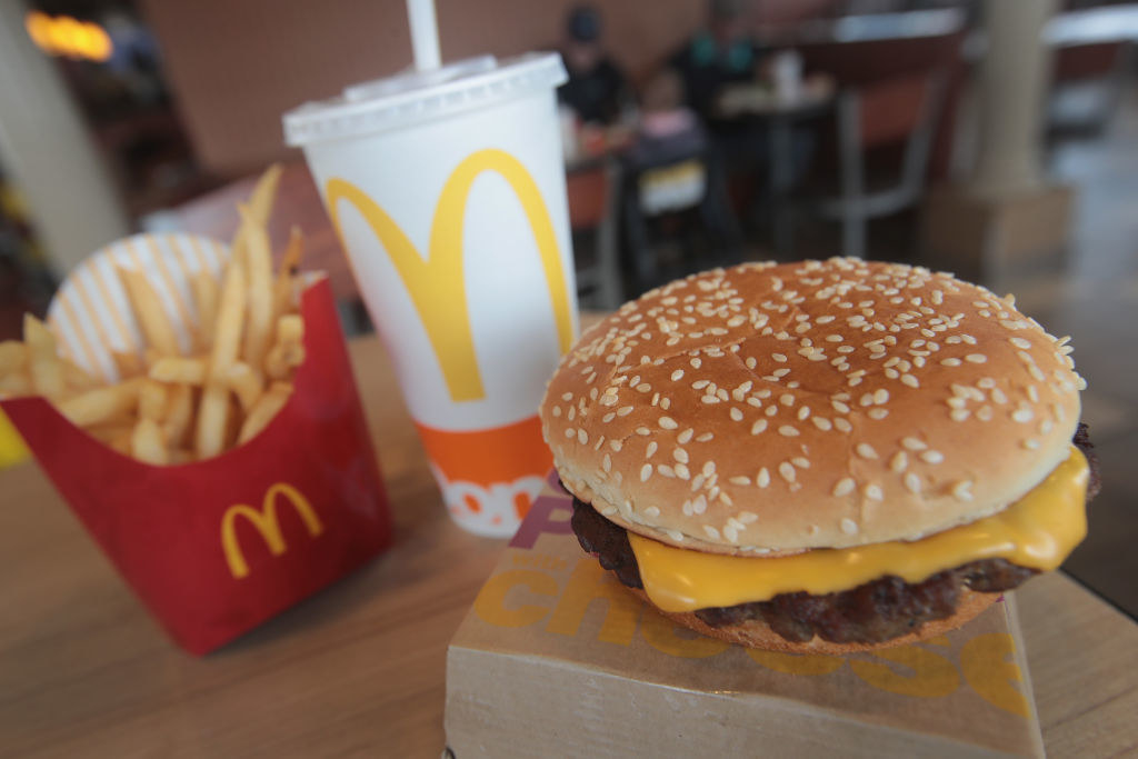 A McDonald&#x27;s meal of a cheeseburger, fries, and a beverage