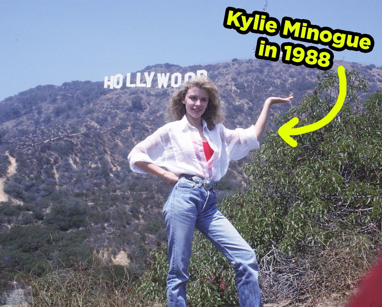 Kylie posing in front of the Hollywood sign in 1988