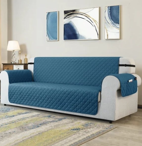 An image of a green sofa slipcover that is machine washable