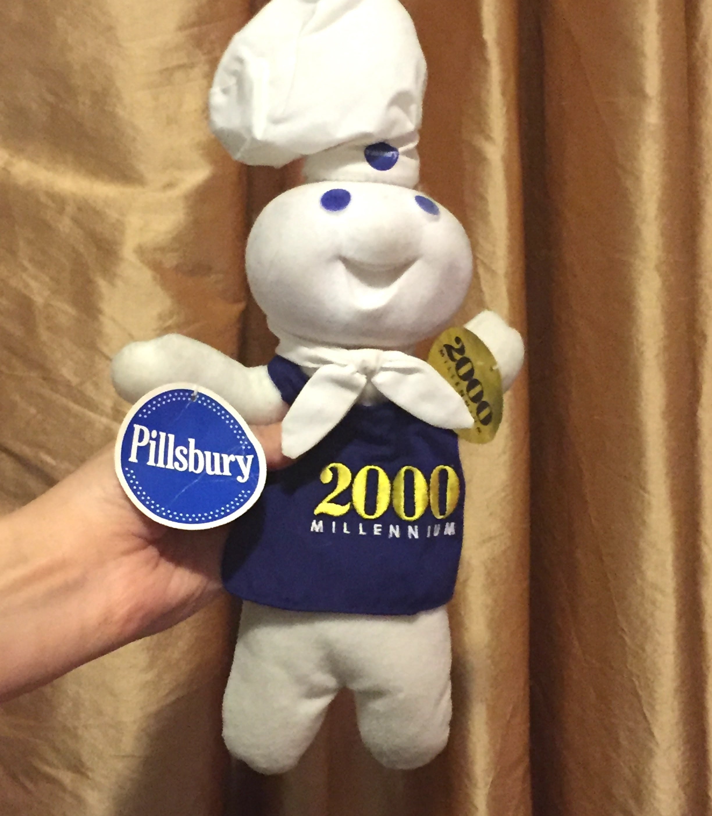 the pillsbury dough boy in a 2000 milennium shirt