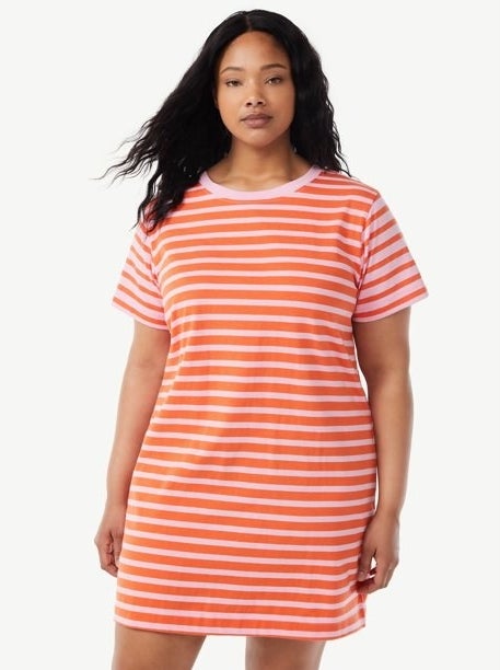 a model wearing the pink and orange striped dress