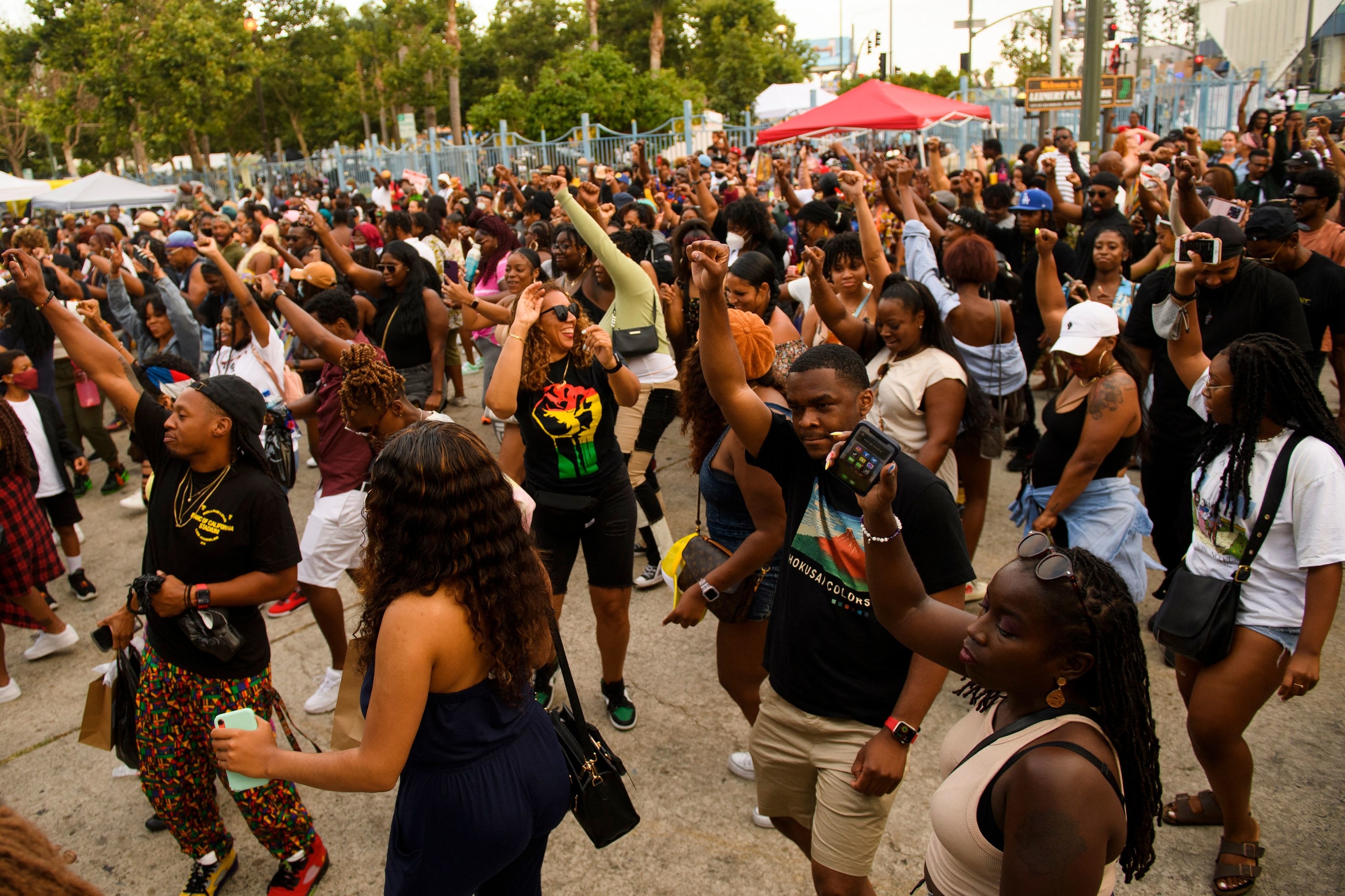 a group raises their fists for Black power