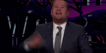 A gif of James Corden fanning his face with his hand