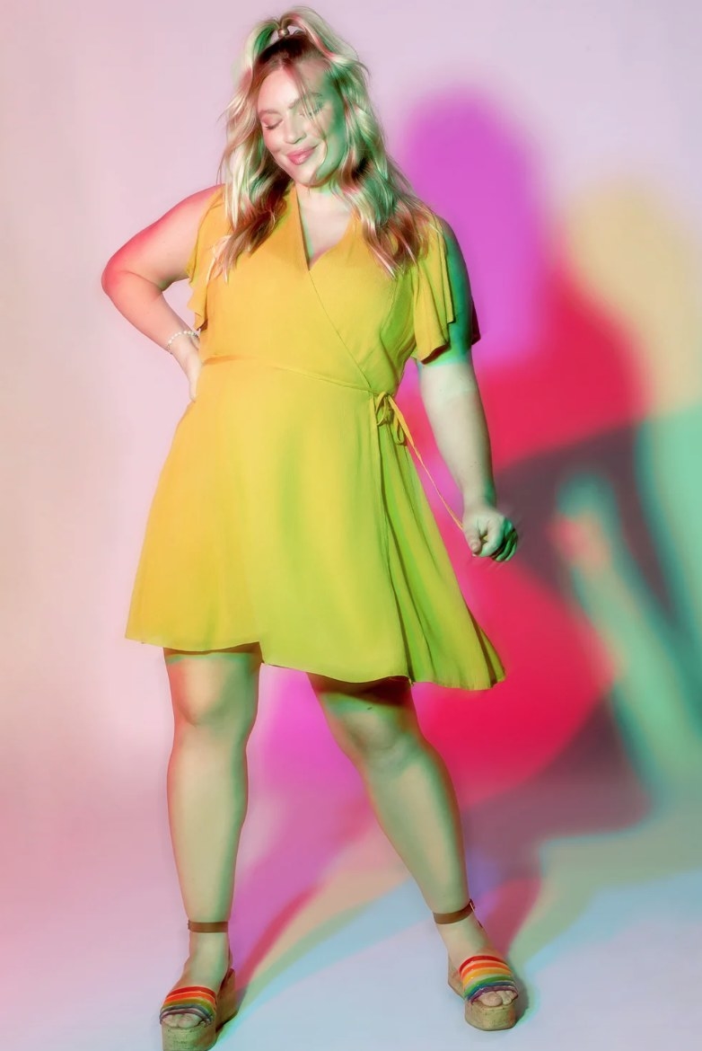 a model wearing the dress in yellow