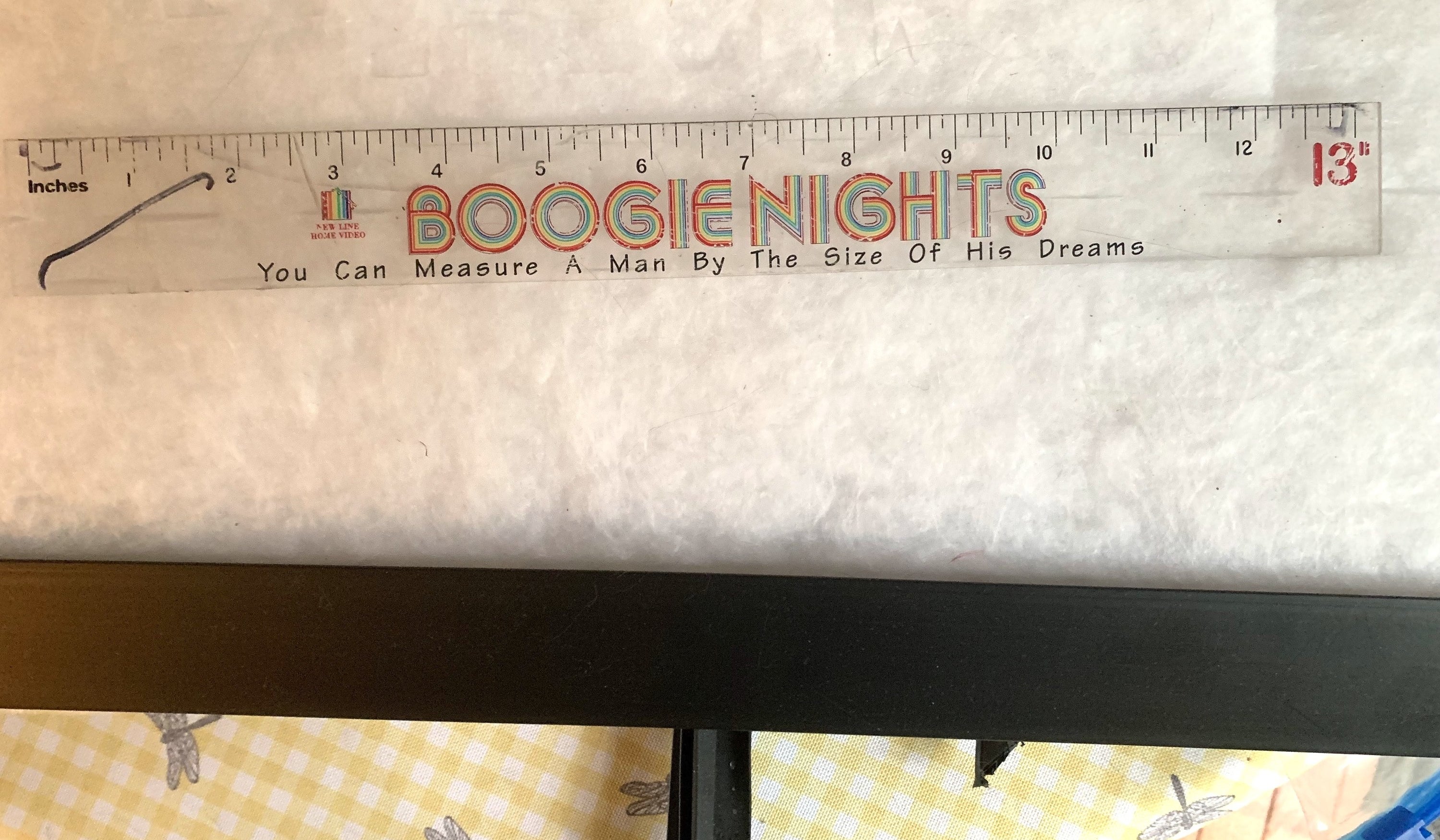 a clear ruler with the Boogie Nights logo