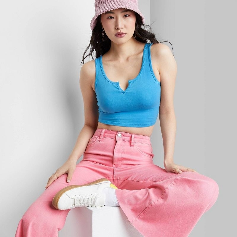 model wearing the top in blue and pink pants