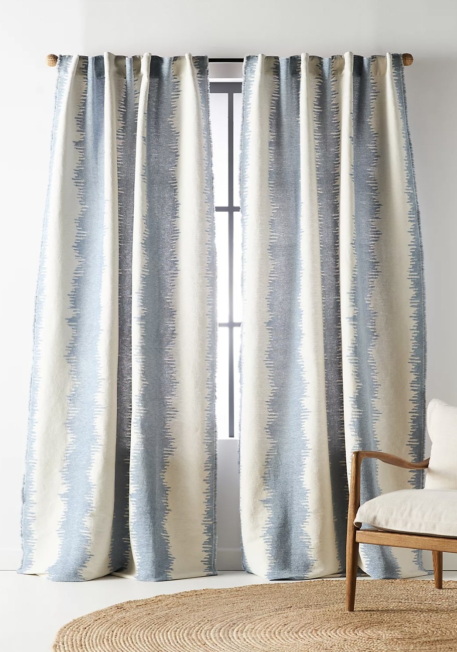 the blue and white curtains in a room