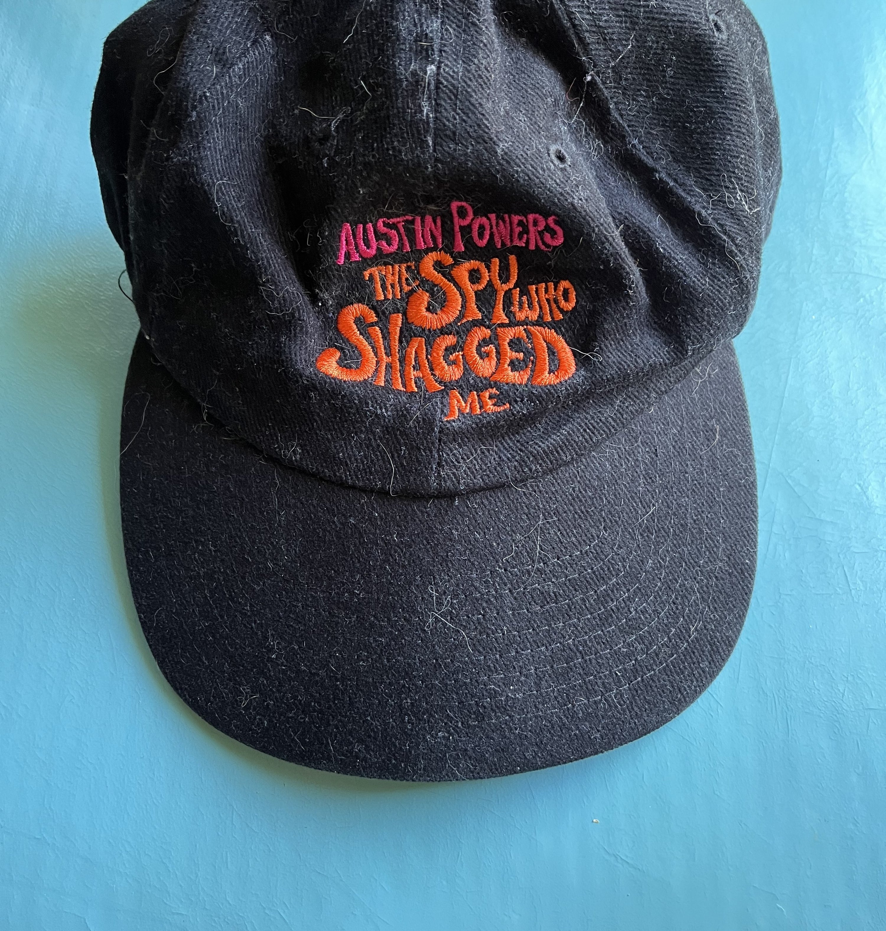 a dark ball cap for the movie Austin Powers
