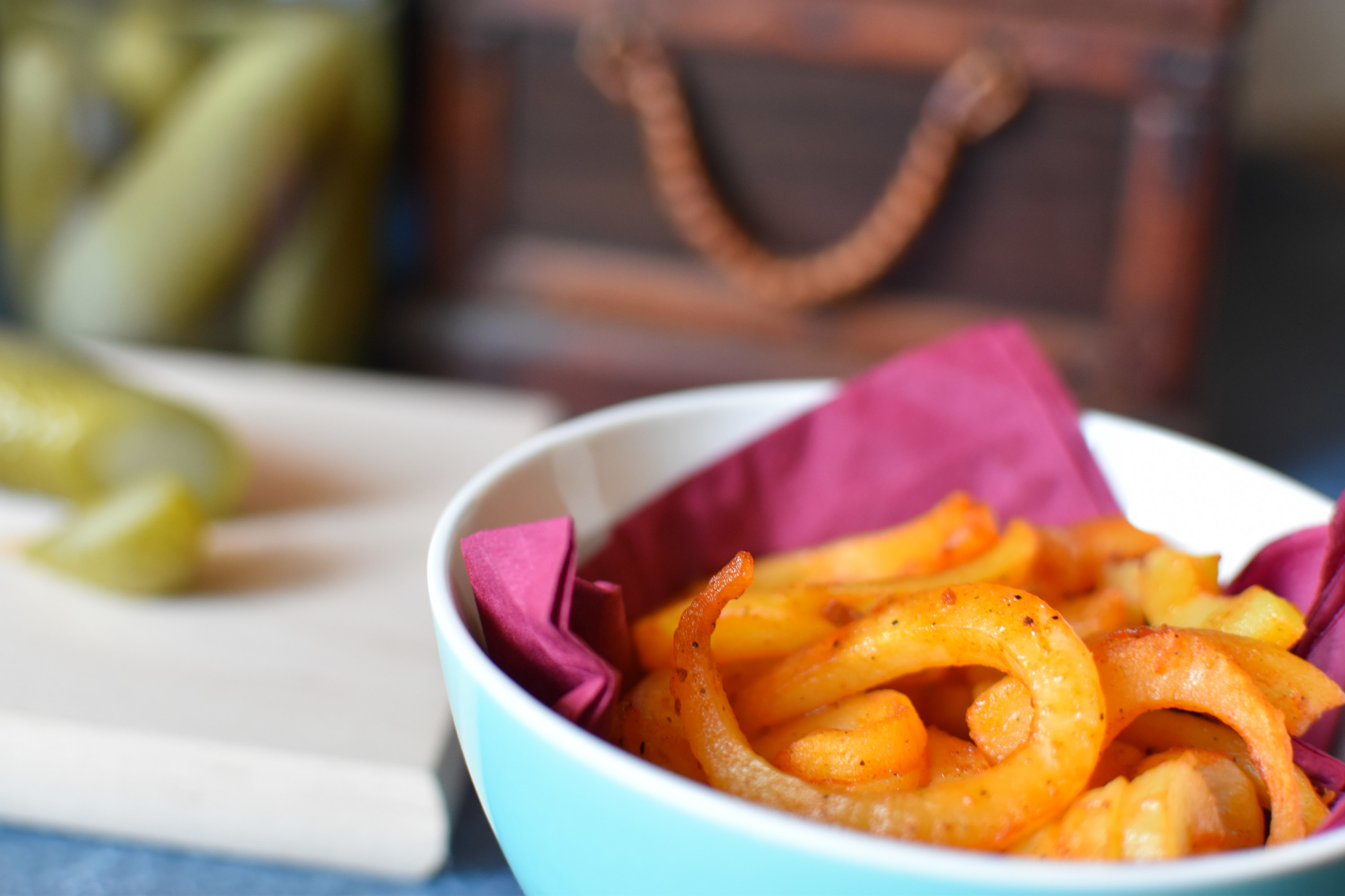 a bowl of curly fries