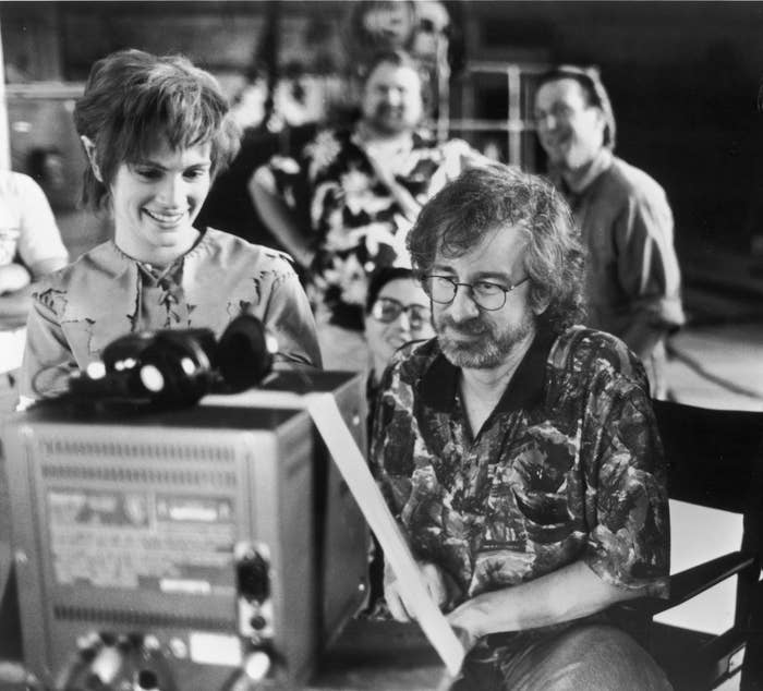 Actor Julia Roberts watches daily production footage with director Steven Spielberg on the set of his film &quot;Hook&quot; in 1991