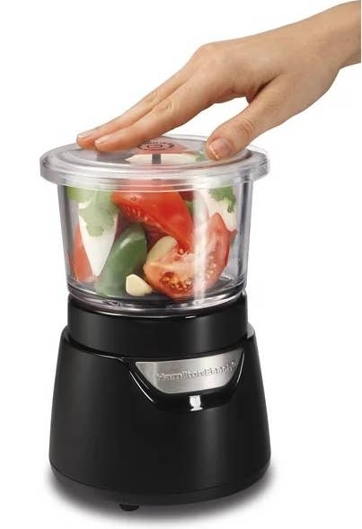 The stack and press chopper with vegetables inside