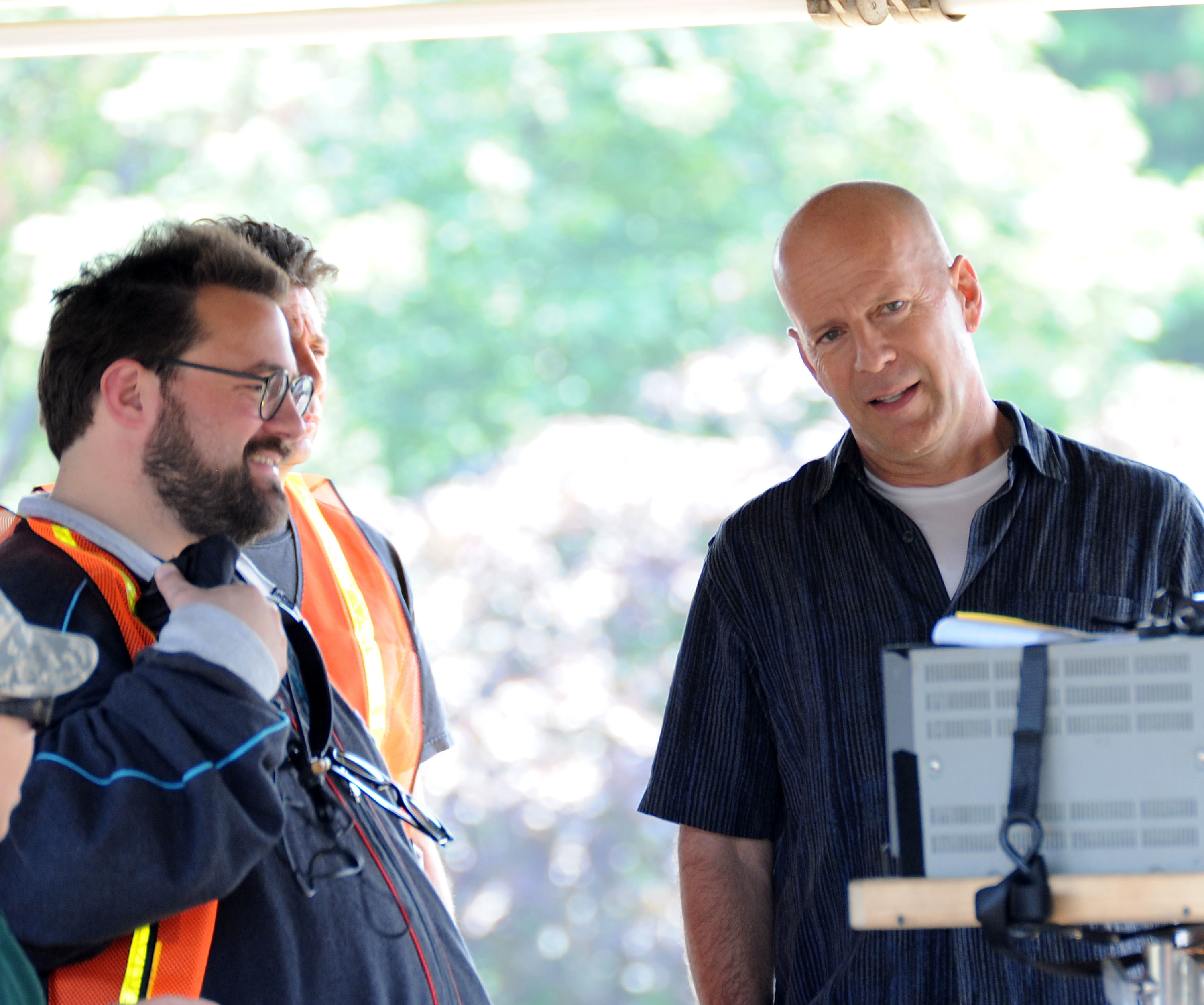 Director Kevin Smith and actor Bruce Willis on location for &quot;A Couple of Dicks&quot; on the streets of Brooklyn on July 22, 2009