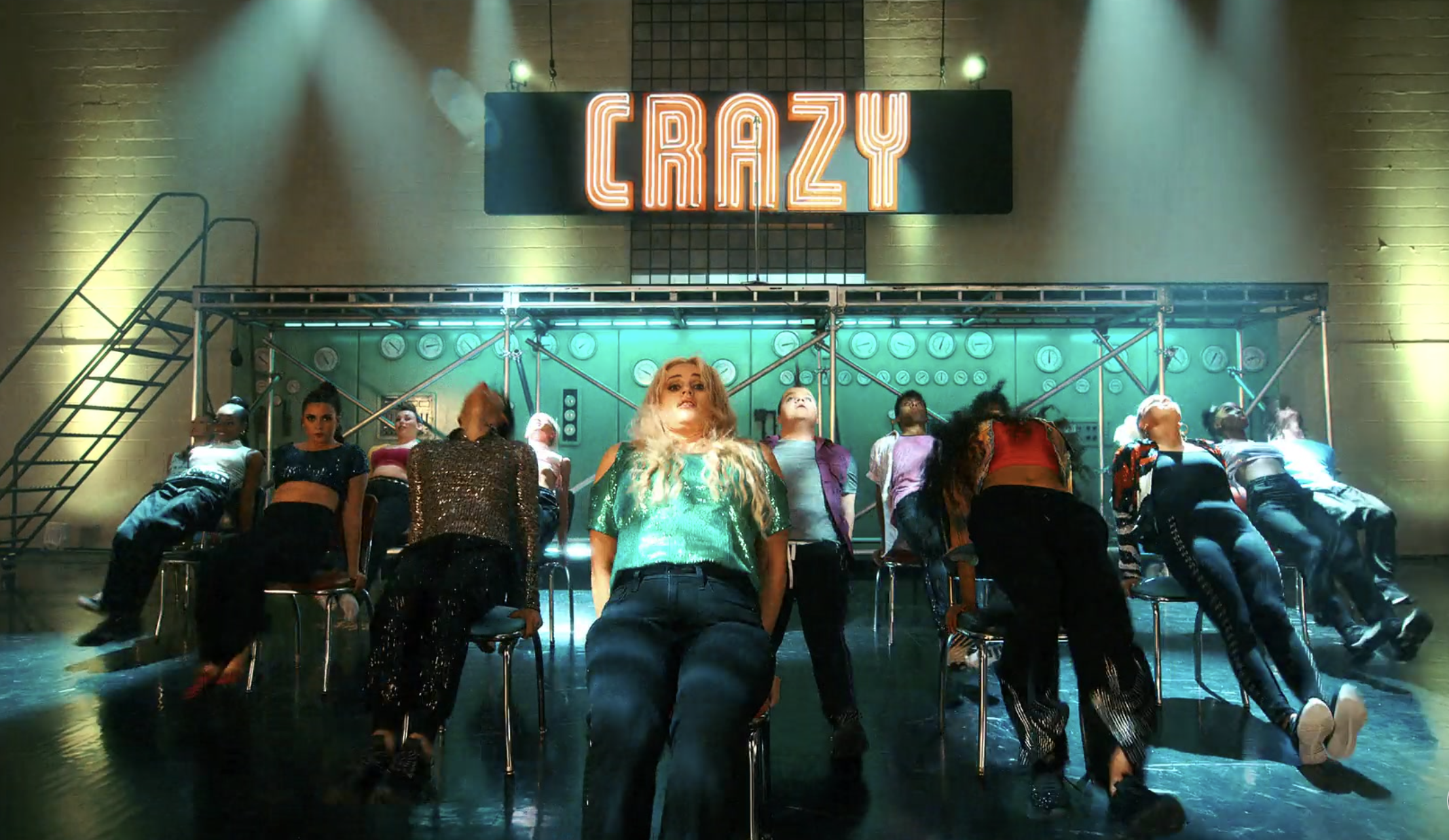 People leaning back in their chairs with a &quot;Crazy&quot; sign above them
