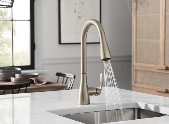 a silver pull-down kitchen faucet in a kitchen