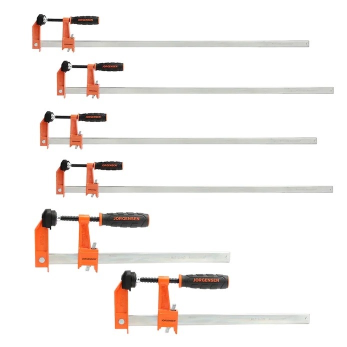 a six-piece set of orange and black clamps