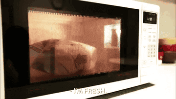 popcorn cooking in a microwave