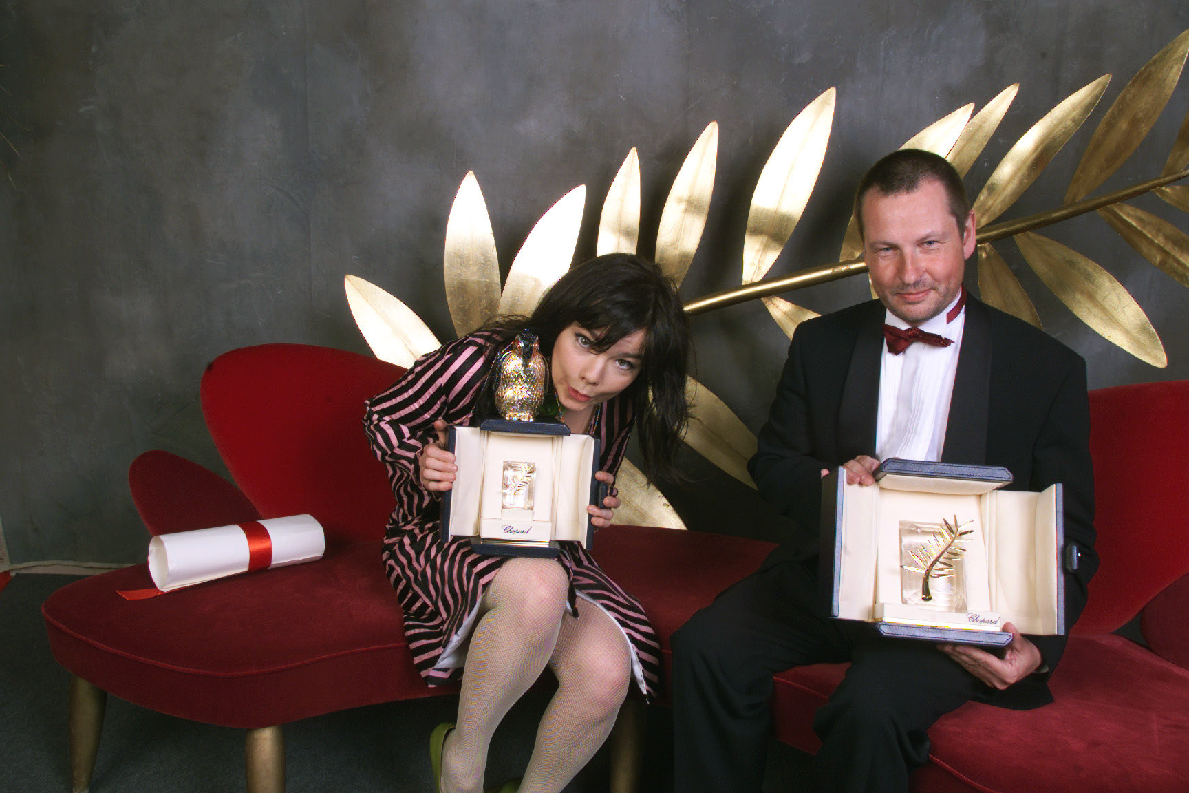 Actor Björk and director Lars von Trier hold up their Golden Palm awards for their movie &quot;Dancer in the Dark&quot; at the Cannes Film Festival in 2000.