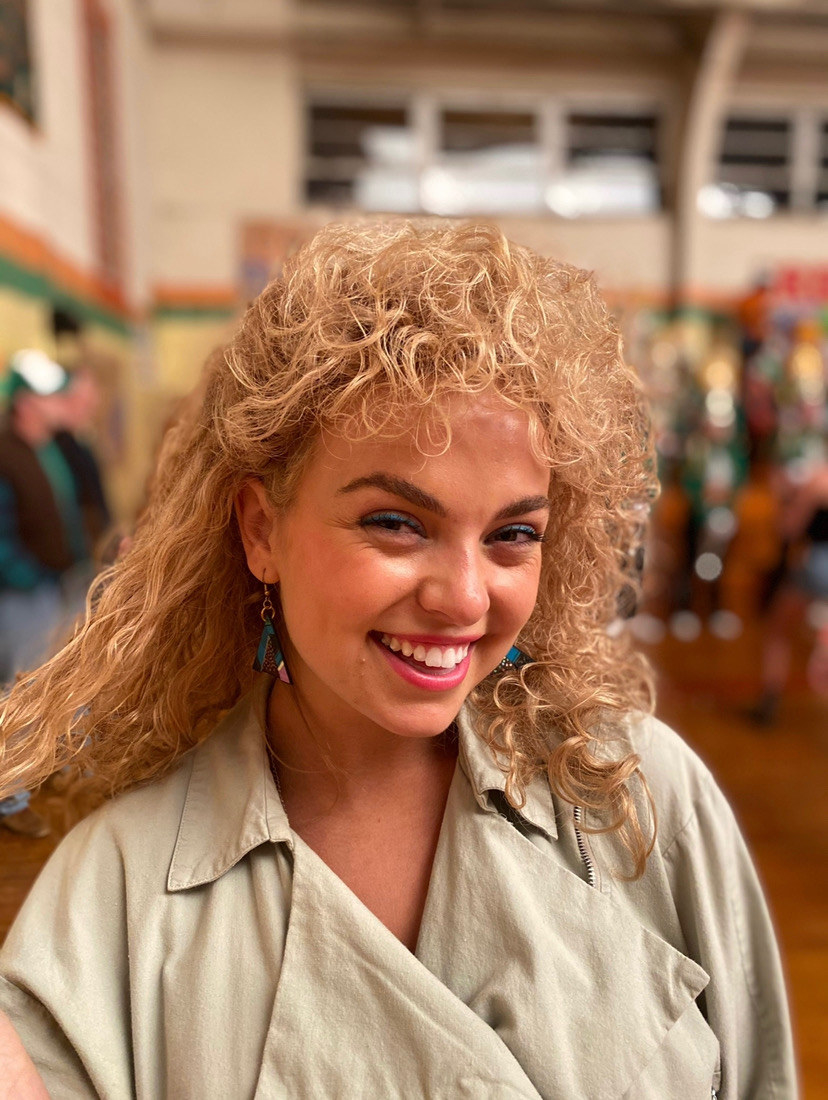 A young girl smiling at the camera