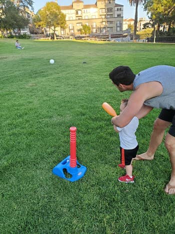 reviewer's photo of their child hitting balls in the park