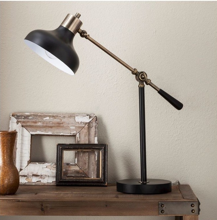 An image of a black and gold schoolhouse desk lamp