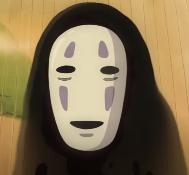 No-Face looking down trying to communicate with Chihiro